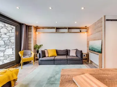 Coin salon dans l'établissement Appartement rénové au pied des pistes avec Parking couvert - FR-1-862-35