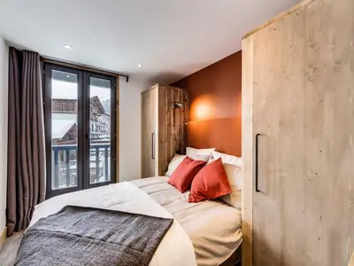 Un ou plusieurs lits dans un hébergement de l'établissement Appartement rénové au pied des pistes avec Parking couvert - FR-1-862-35