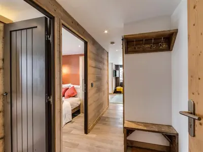 Un ou plusieurs lits dans un hébergement de l'établissement Appartement rénové au pied des pistes avec Parking couvert - FR-1-862-35