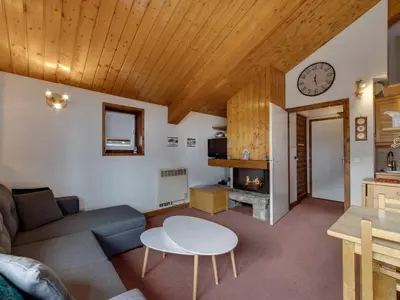 Coin salon dans l'établissement Appartement lumineux 5 pers, cheminée, parking couvert - FR-1-862-31