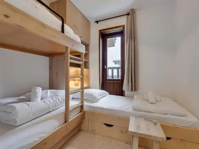 Un ou plusieurs lits dans un hébergement de l'établissement Appartement lumineux 5 pers au pied des pistes avec parking couvert - FR-1-862-39