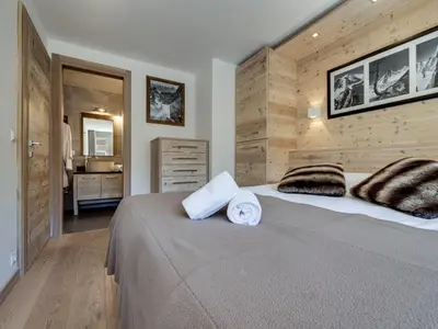 Un ou plusieurs lits dans un hébergement de l'établissement Appartement rénové au pied des pistes avec parking à Val d'Isère - FR-1-862-38