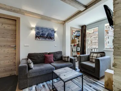 Coin salon dans l'établissement Appartement rénové au pied des pistes avec parking à Val d'Isère - FR-1-862-38