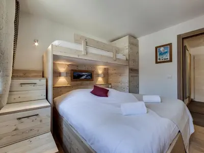 Un ou plusieurs lits dans un hébergement de l'établissement Appartement rénové au pied des pistes avec parking à Val d'Isère - FR-1-862-38