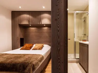 Un ou plusieurs lits dans un hébergement de l'établissement Appartement rénové ski aux pieds balcon à Val-d'Isère - FR-1-862-44