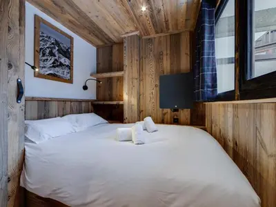 Un ou plusieurs lits dans un hébergement de l'établissement Appartement rénové au pied des pistes avec WiFi - FR-1-862-63