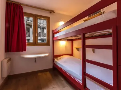Un ou plusieurs lits dans un hébergement de l'établissement Appartement skis aux pieds avec parking couvert, 4 pers. - FR-1-862-66