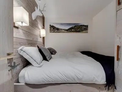 Un ou plusieurs lits dans un hébergement de l'établissement Appartement rénové, confort moderne au pied des pistes - FR-1-862-58
