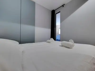 Un ou plusieurs lits dans un hébergement de l'établissement Appartement Rénové 4 Pers. Ski aux Pieds avec Parking - FR-1-862-53