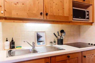 Cuisine ou kitchenette dans l'établissement Le Cocon
