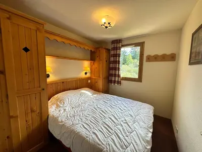 Un ou plusieurs lits dans un hébergement de l'établissement Appartement 4 pers, pied des pistes avec balcon, parking inclus - FR-1-508-315