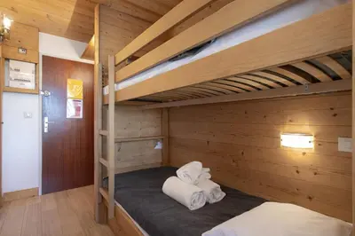 Un ou plusieurs lits dans un hébergement de l'établissement Appartement central ski et commerces à pied - Val d'Isère