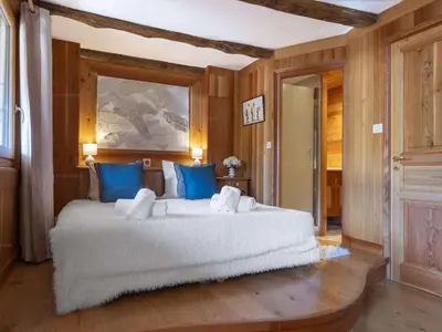 Un ou plusieurs lits dans un hébergement de l'établissement Superbe Triplex de 200 m² à Courchevel avec Parking - FR-1-864-1