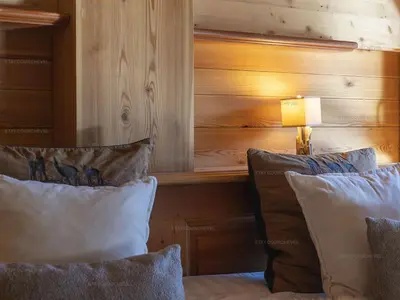 Un ou plusieurs lits dans un hébergement de l'établissement Superbe Triplex de 200 m² à Courchevel avec Parking - FR-1-864-1