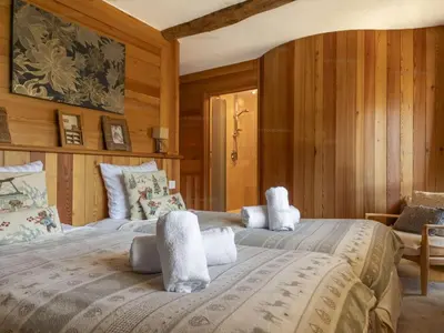 Un ou plusieurs lits dans un hébergement de l'établissement Superbe Triplex de 200 m² à Courchevel avec Parking - FR-1-864-1