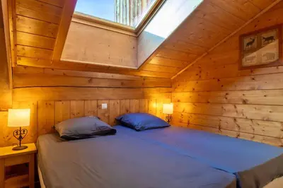Un ou plusieurs lits dans un hébergement de l'établissement Capella - Spa, Calme & Vue Montagne