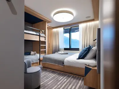 Un ou plusieurs lits dans un hébergement de l'établissement Chalet spacieux à Arc 1800 avec piscine intérieure et sauna - FR-1-866-3