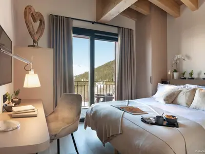 Un ou plusieurs lits dans un hébergement de l'établissement Chalet de luxe aux Arcs 1800 avec espace bien-être - FR-1-866-14