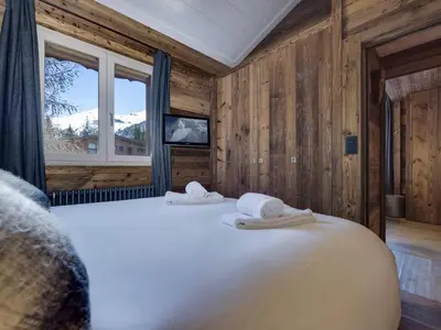 Un ou plusieurs lits dans un hébergement de l'établissement Chalet de charme 3 chambres à Val-d'Isère, proche centre et pistes - FR-1-862-8