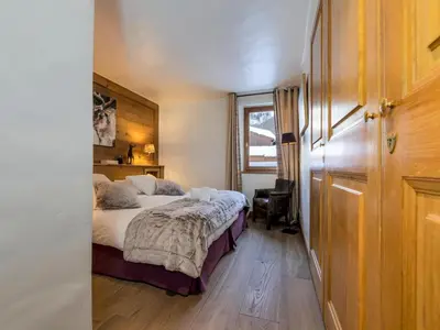 Un ou plusieurs lits dans un hébergement de l'établissement Appartement spacieux aux pieds des pistes avec parking couvert - FR-1-862-18
