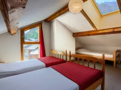 Un ou plusieurs lits dans un hébergement de l'établissement Duplex confortable 3 chambres, proche pistes et commerces - FR-1-862-21