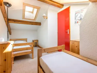 Un ou plusieurs lits dans un hébergement de l'établissement Duplex confortable 3 chambres, proche pistes et commerces - FR-1-862-21