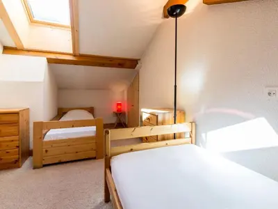 Un ou plusieurs lits dans un hébergement de l'établissement Duplex confortable 3 chambres, proche pistes et commerces - FR-1-862-21