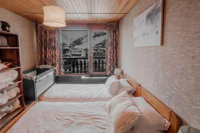 Un ou plusieurs lits dans un hébergement de l'établissement Iseran 804 appartement cosy avec vue