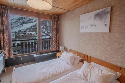 Un ou plusieurs lits dans un hébergement de l'établissement Iseran 804 appartement cosy avec vue