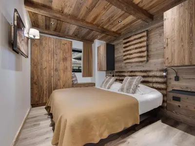 Un ou plusieurs lits dans un hébergement de l'établissement Appartement rénové 4 chambres ski aux pieds avec parking à Val-d'Isère - FR-1-862-9
