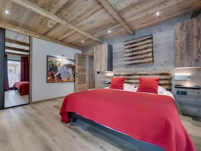 Un ou plusieurs lits dans un hébergement de l'établissement Appartement rénové 4 chambres ski aux pieds avec parking à Val-d'Isère - FR-1-862-9