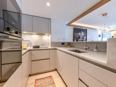 Cuisine ou kitchenette dans l'établissement Appartement standing avec cheminée, terrasse et accès détente - FR-1-694-444