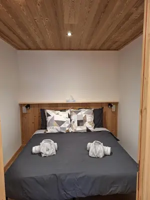 Un ou plusieurs lits dans un hébergement de l'établissement Appartement 4 personnes proche des pistes de ski