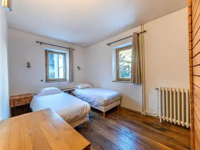 Un ou plusieurs lits dans un hébergement de l'établissement Appartement de charme avec sauna près des pistes - FR-1-694-445