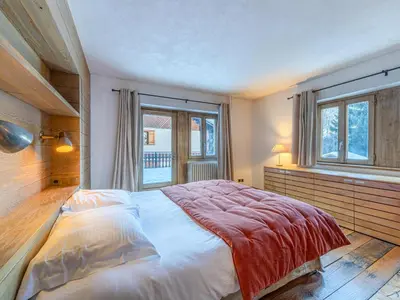 Un ou plusieurs lits dans un hébergement de l'établissement Appartement de charme avec sauna près des pistes - FR-1-694-445