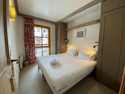 Un ou plusieurs lits dans un hébergement de l'établissement Arcs 1950 Ski-in-out Appartement 4 chambres