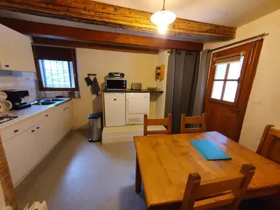 Cuisine ou kitchenette dans l'établissement Au coeur du village Val Cenis Bramans