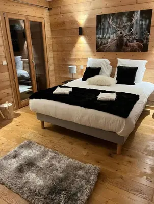 Un ou plusieurs lits dans un hébergement de l'établissement Chalets Pierra Menta & Mont d'Argent
