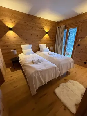 Un ou plusieurs lits dans un hébergement de l'établissement Chalets Pierra Menta & Mont d'Argent