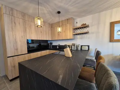 Cuisine ou kitchenette dans l'établissement Sublime appartement 10pers - St Foy village