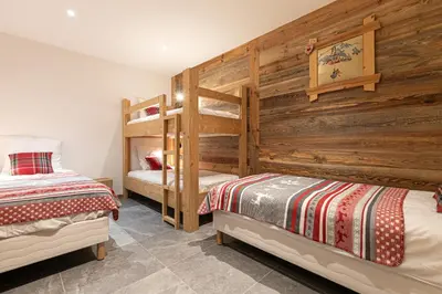 Un ou plusieurs lits dans un hébergement de l'établissement Marmotton 103 - Duplex avec terrasse et sauna à coté des pistes