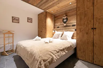 Un ou plusieurs lits dans un hébergement de l'établissement Marmotton 103 - Duplex avec terrasse et sauna à coté des pistes