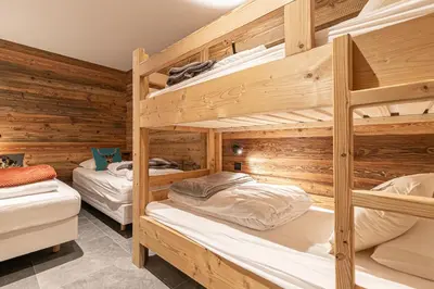 Un ou plusieurs lits dans un hébergement de l'établissement Marmotton 102 - Duplex à coté des pistes