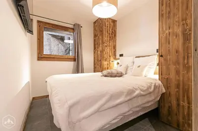 Un ou plusieurs lits dans un hébergement de l'établissement Marmotton 101 - Duplex à coté des pistes
