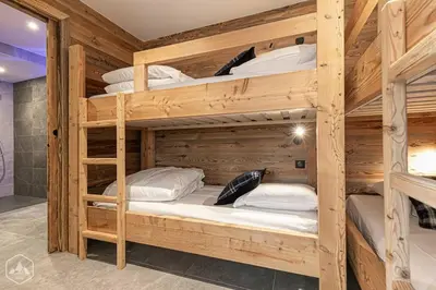 Un ou plusieurs lits dans un hébergement de l'établissement Marmotton 101 - Duplex à coté des pistes