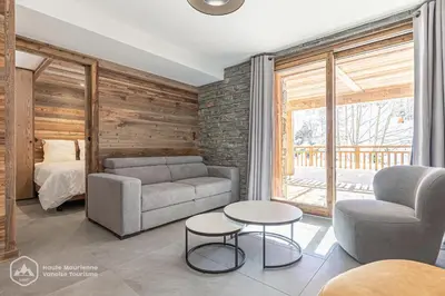 Coin salon dans l'établissement Marmotte RDJ01 - Appartement neuf en face du télésiège