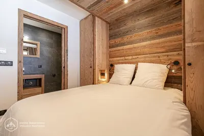 Un ou plusieurs lits dans un hébergement de l'établissement Marmotte RDJ01 - Appartement neuf en face du télésiège