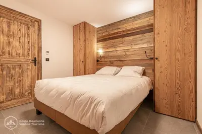 Un ou plusieurs lits dans un hébergement de l'établissement Marmotte RDJ01 - Appartement neuf en face du télésiège