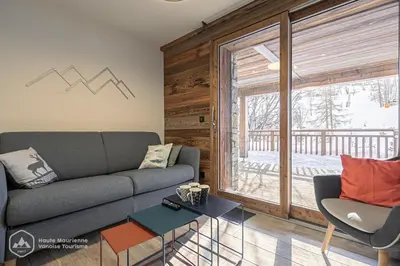 Coin salon dans l'établissement Résidence la Marmotte - La Trace - Appartement neuf en face du télésiège