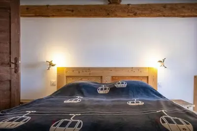 Un ou plusieurs lits dans un hébergement de l'établissement Chalet La Pommeraie - OVO Network